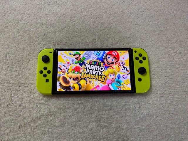 NINTENDO SWITCH OLED with 100 SWITCH GAMES INSTALLED