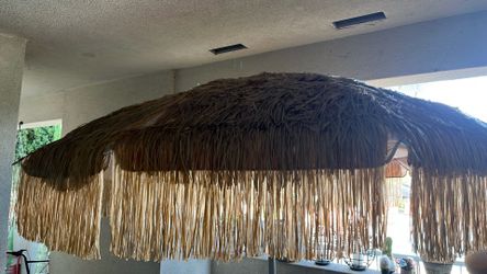 Beautiful Bambu umbrella for out door use with very strong stable concrete base water proof great for patios