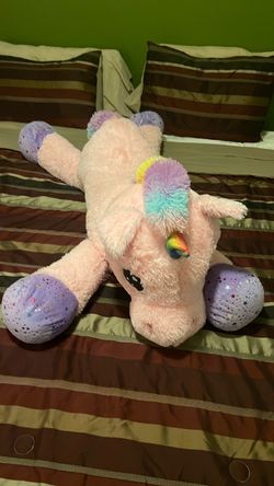 Oversized, plush pink unicorn