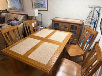 Solid oak table with granite top and buffet