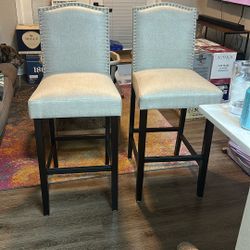2 beigish bar chairs