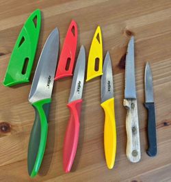 Moving out sale. Set of 3 knives + 2 extra knives