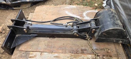 Digger attachment for mini skid steer