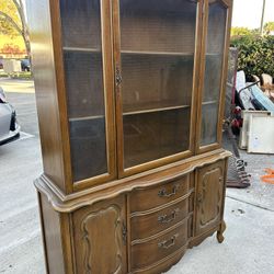 Vintage antique Gorgeous honey wood china dining cabinet with Hand carved details and metal  fixture