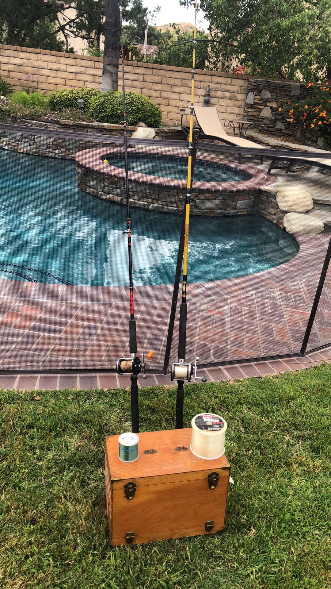 Two Saltwater Fishing Rods with Penn Reels with Wood Tackle Box full of lures,Jigs,2 spools of line.