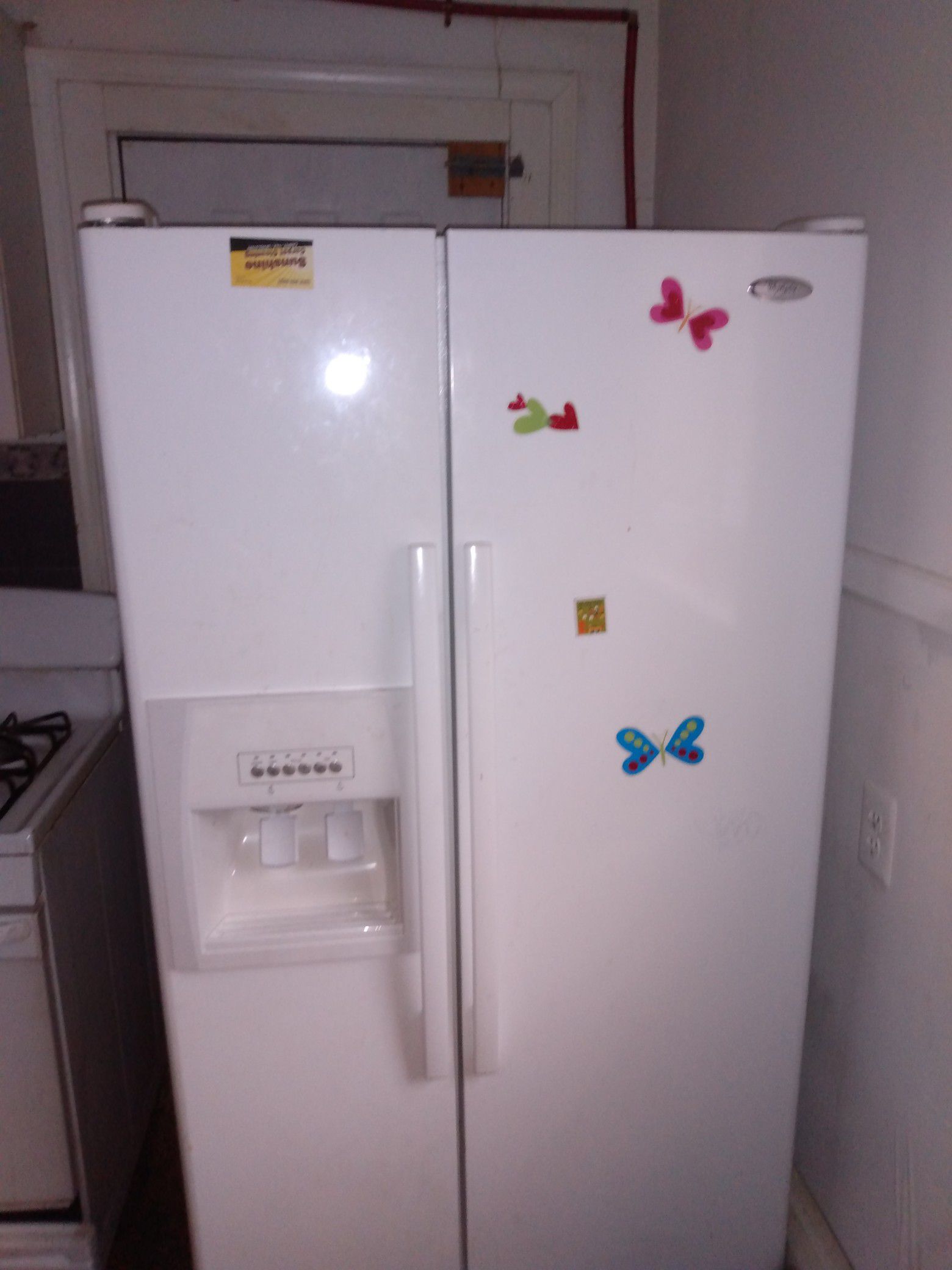 Whirlpool refrigerator side by side Kenmore washing machine 500 series in a Kenmore dryer 80 series