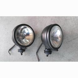 Two 6 inch round off road spot lights and one blazer halogen light