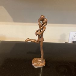 Small Bronze Statue Of Man, Kissing Lady While Holding Her.