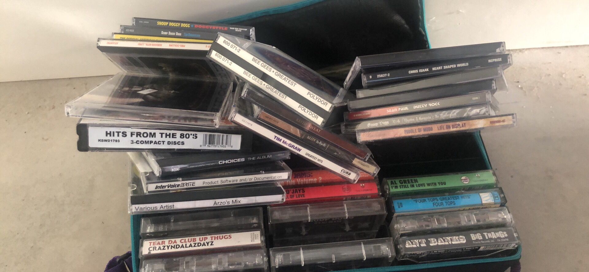 Over 30 CD’s and cassettes with carrying case
