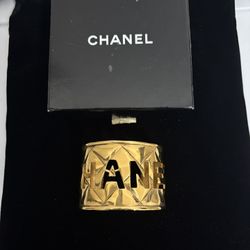 Vintage Chanel Gold-Plated Brass Cuff Bracelet with Bold Cut-Out Logo