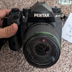 Pentax K-1 full frame 36mp stabilized DSLR with 28-105 ED DC WR lens and flash.