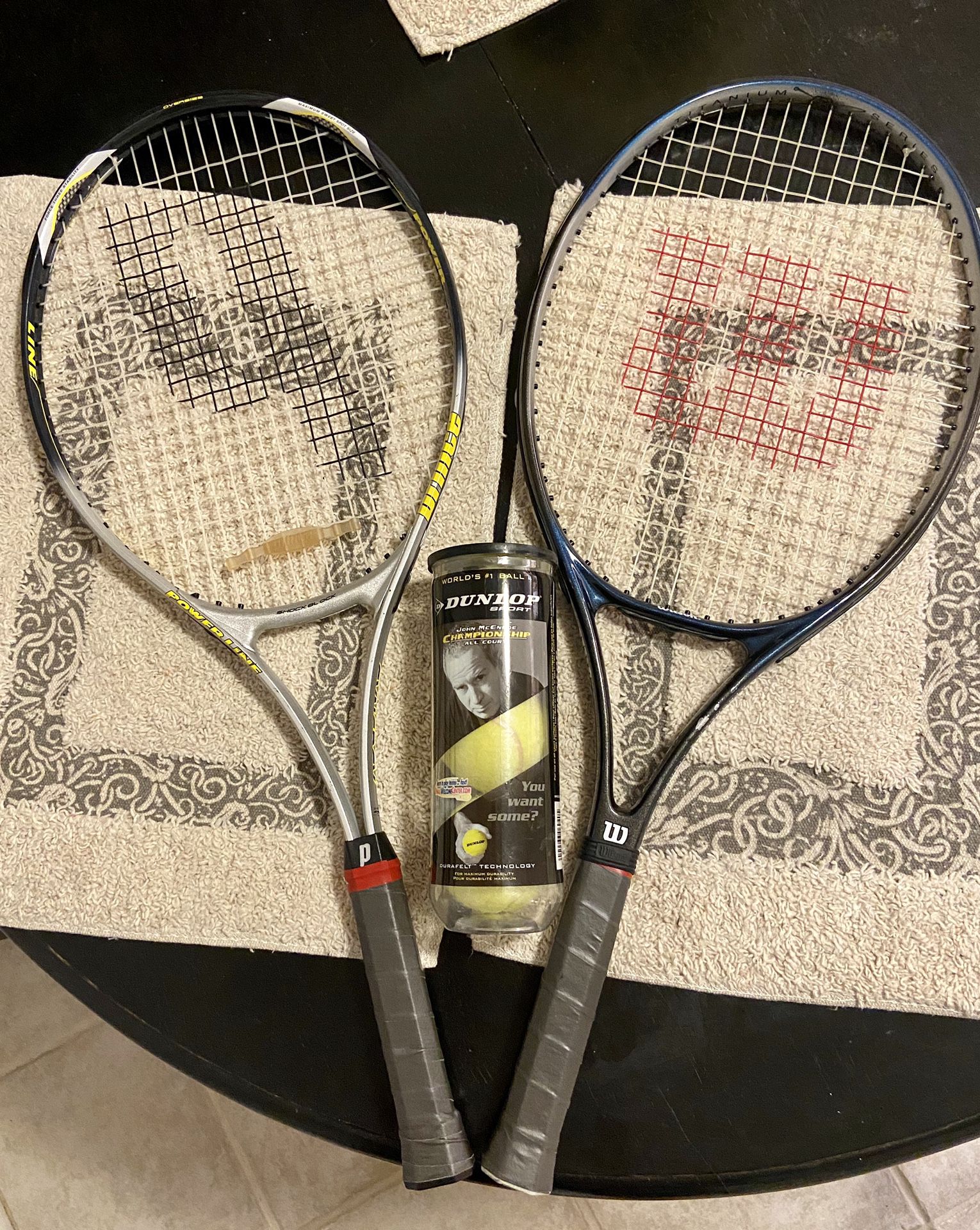 1 Prince & 1 Wilson Tennis Rackets (w/ new grips & 1 can of Tennis balls)