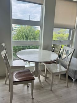 White table with 4 chairs for sale