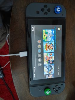 Nintendo switch with box and all accessories plus 8 games and pro controller