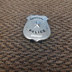 NOVELTY METAL BADGE.  GREAT FOR KIDS.  NEW.  PICKUP ONLY
