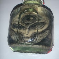 Alien Tattoo On Skin In A Bottle