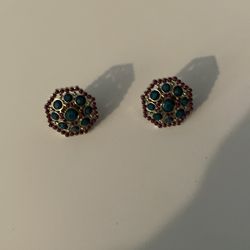 Selena rings 2 for 20 stones are blue and smaller stones are drk red