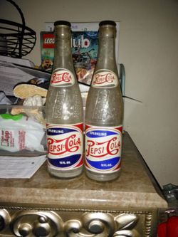 2 different years Pepsi bottles vintage