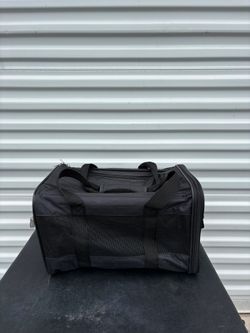 Small Black Petmate soft-sided carrier features durable mesh panels for ventilation. Dinensions 10”x10”x16”
