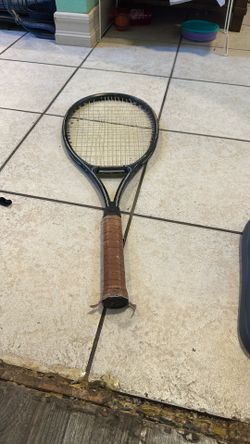 Black Tennis Racket With Brown Leather Handle