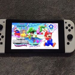 NINTENDO SWITCH with 125 SWITCH GAMES + 7500 RETRO CLASSIC GAMES INCLUDED