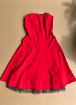 red strapless mini dress with a dark underskirt