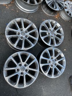 JEEP Used set of rims 18 inch  OEM original 18 INCH 150$ for 4 rims plus tax . Sold AS IS.  Mount available but not included.  Wheel alignment availab