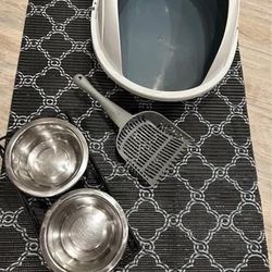 Like New Cat Litter Box with Guard and Spoon $10, Cat Litter Mat $5, Bowls in Metal Stand $8.  Less than a month old. 