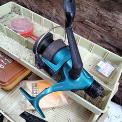 Okuma Steeler40 Reel,Daiwa Ag2600x Reel,And Plano Tackle Box With Misc Hooks,Spinners, Weights, Bobbers,Mini Magnum Pocket Pack . Etc