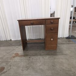 Brown Wood Four-Drawer Desk with Round Knobs