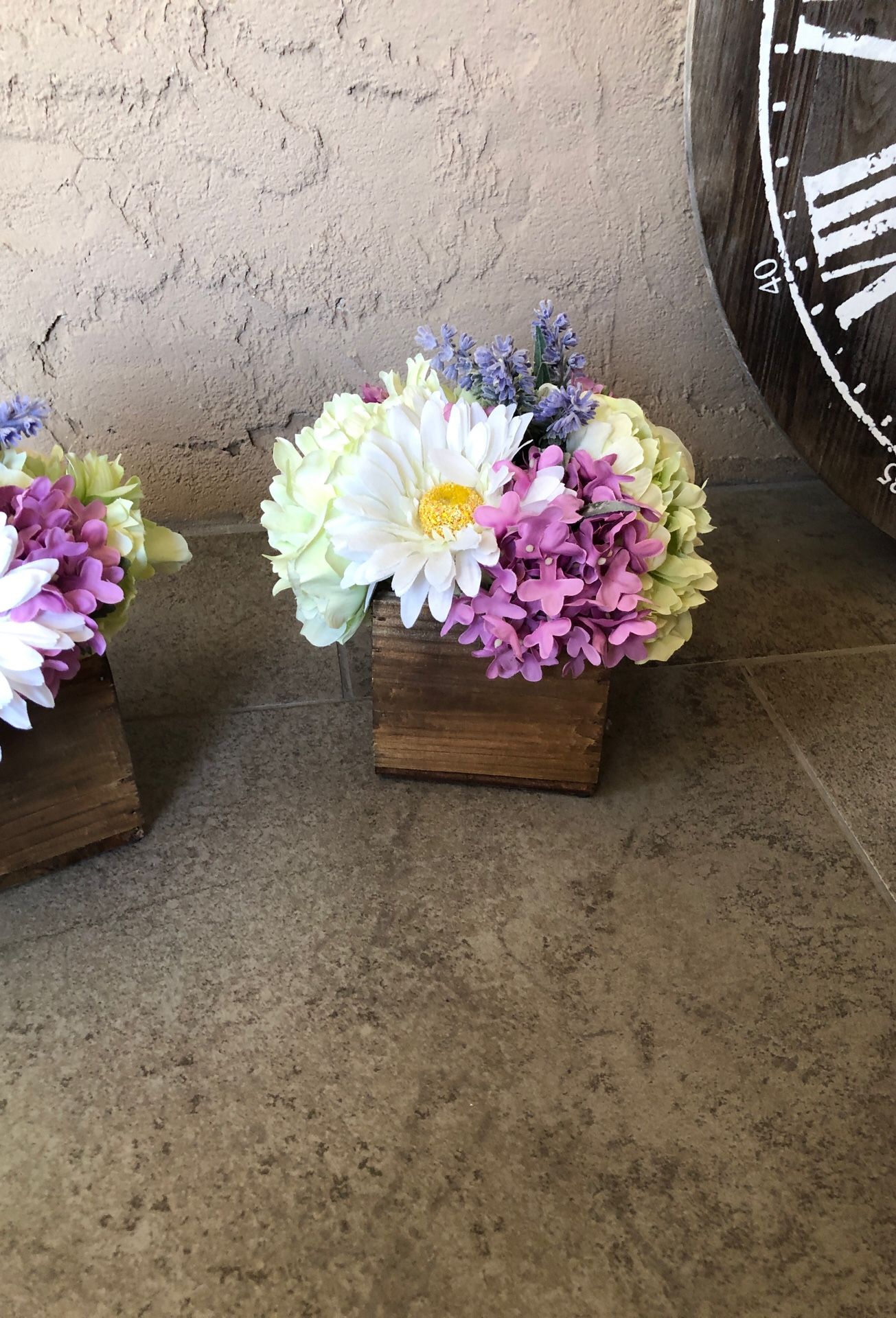 2 artificial flower arrangements in square wooden vase