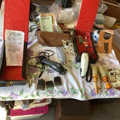 Barber shop supplies including three vintage razors and several attachments, Sears, Body and Fostoria Three storage bags/boxes, shaving items, scissor