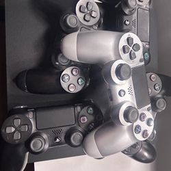 PS4 slim and five controllers