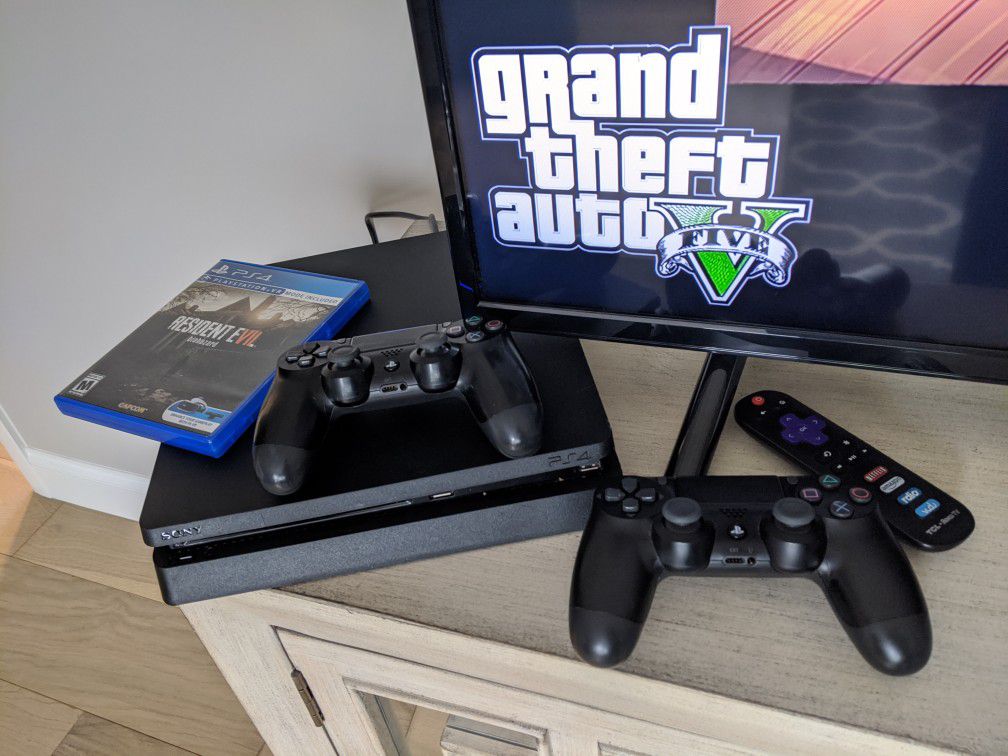 PS4 slim with 2 controllers and 2 games