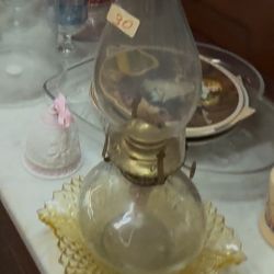 Vintage clear glass oil lamp with a brass burner