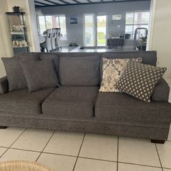Sofa With Four Decorative Pillows