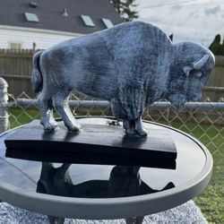 The old gray buffalo statue