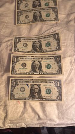 3 $1 dollar bills in sequence with star
