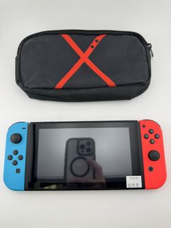 Nintendo Switch Console with Red/Blue Joy-Cons and Carrying Case
