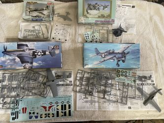 Set of 4 Vtg Collectible Airplane/submarine model kits, partially put together, sticker sheets