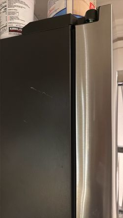 GE silver refrigerator and freezer