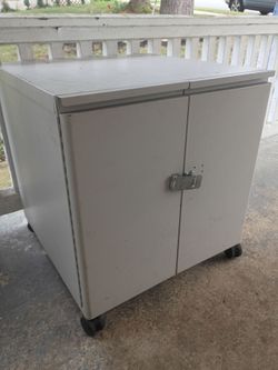 Heavy-gauge painted steel, with a hinged double-door design