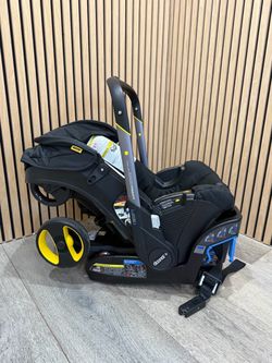 Doona Infant Car Seat & Stroller with LATCH Base and newborn inserts