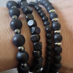Black beaded stretch bracelets, wooden, new. $2 each