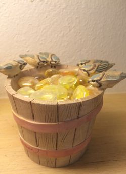 Hawaiian vet with six birds sitting on top of it