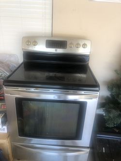 Kenmore electric oven and Whirlpool microwave