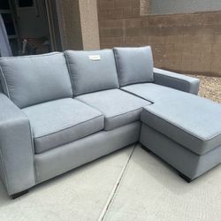 Beautiful like new apartment size sofa with chase.