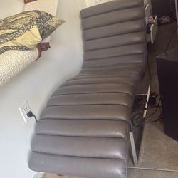 Faux leather fainting couch type chair. Very comfy.