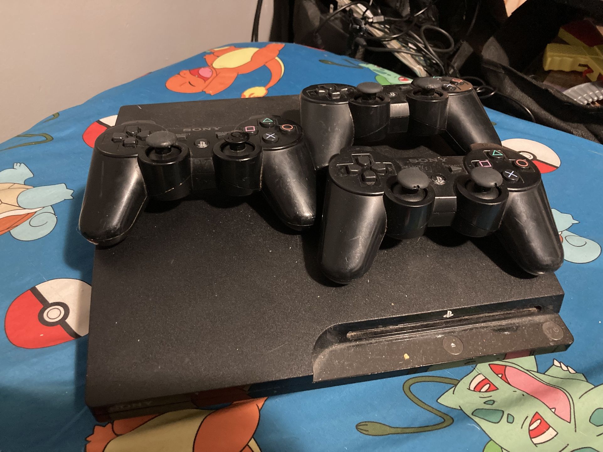 PlayStation 3 Slim Includes 3 Controllers