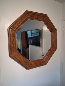 Large mirror with beautifully carved, solid wood back/border